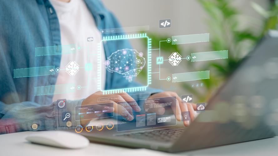 Person working on a laptop with a digital visualization of an AI system, code, and automated workflows.